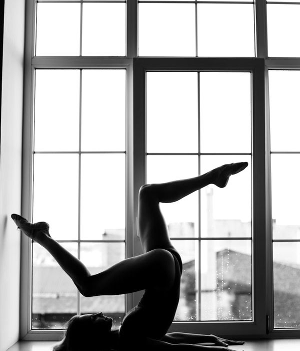Woman performing a calm, balanced cardio movement indoors.